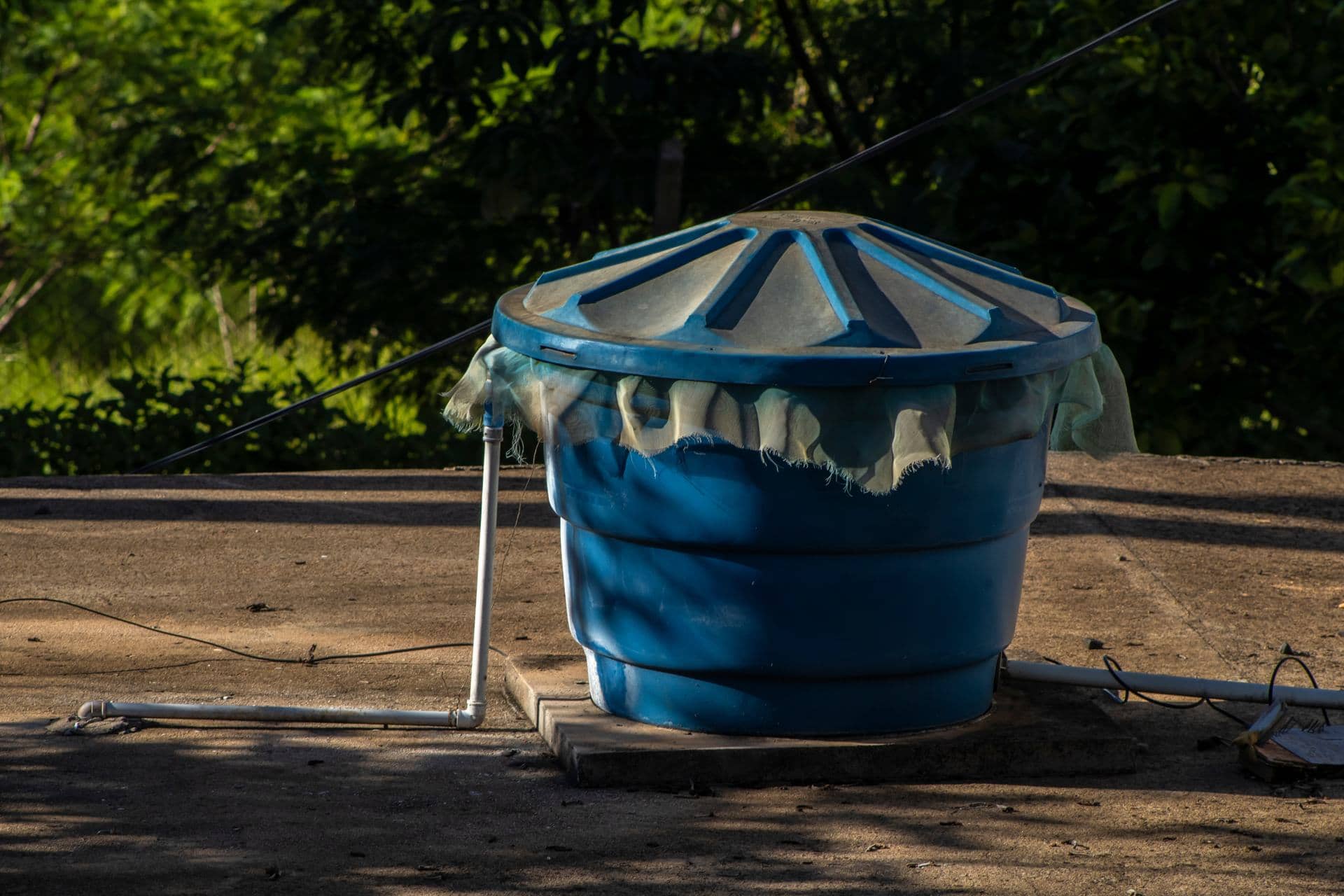 Rooftop water tank on a Dubai building before cleaning