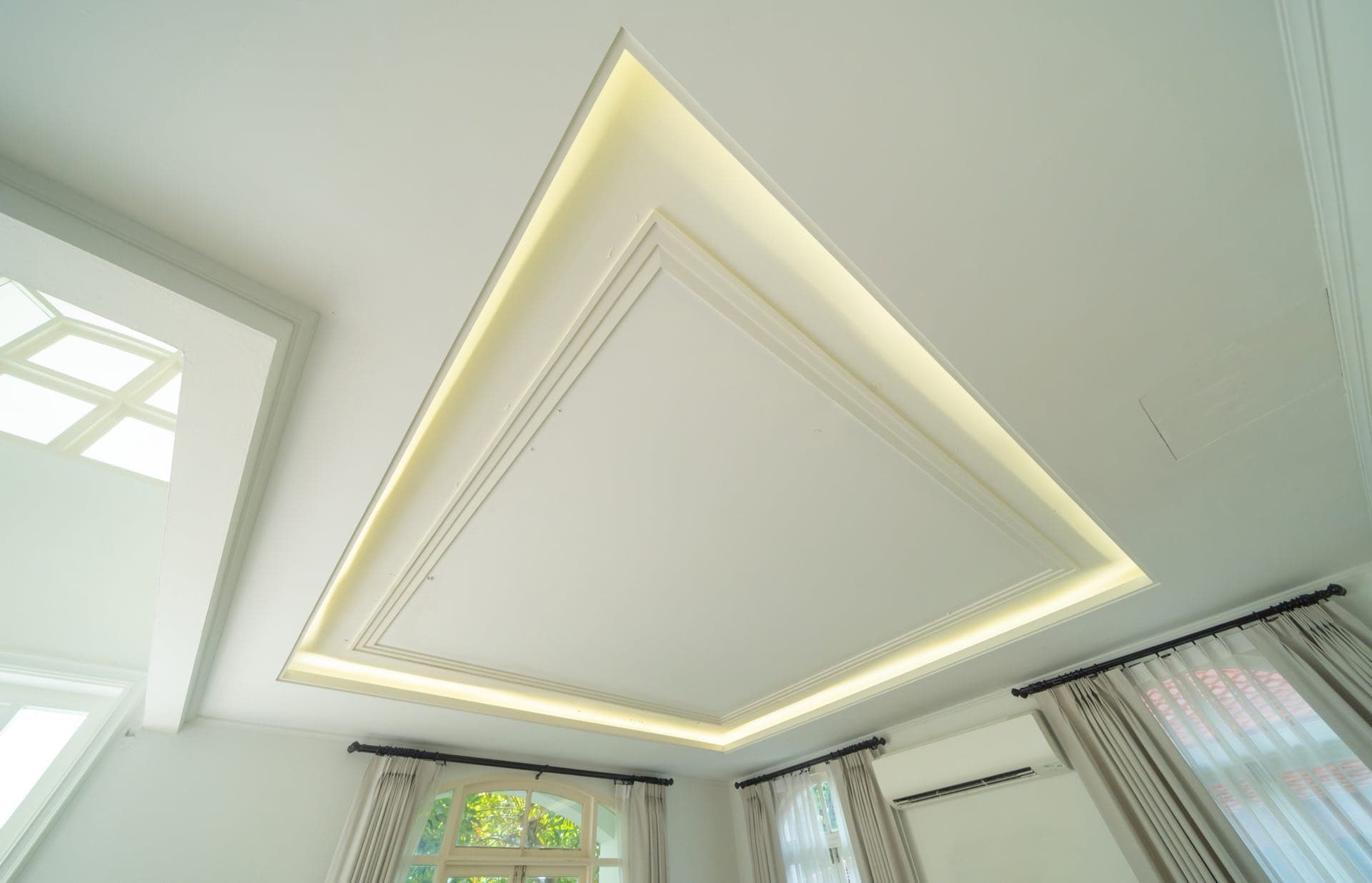 Cove and Recessed Lighting in Dubai: Coffered white ceiling with warm concealed cove lighting