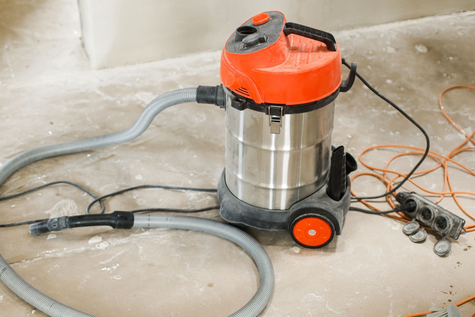 Post-Renovation Cleaning in Dubai: Industrial vacuum cleaner on a dusty floor after renovation work